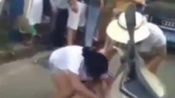 Chinese wives strip mistress in street