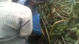 A village girl is undressed and groped in public