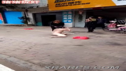 Chinese women stripped naked in street