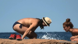 milf on beach with huge tits and a hat