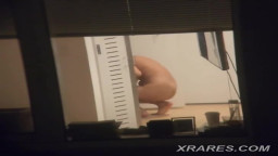 he films his neighbor through the window