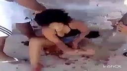 Woman stripped naked and beaten by gangsters